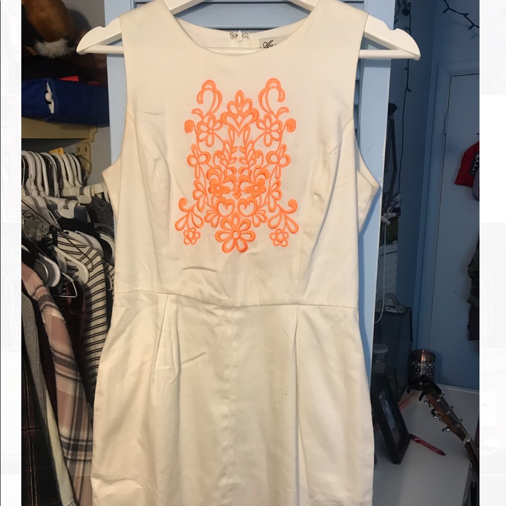 off-white dress w/orange thread design